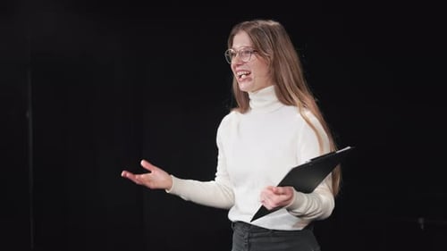 Woman Giving Presentation on Stage