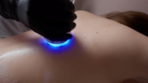 Blue Light Therapy on Skin in a Spa Setting