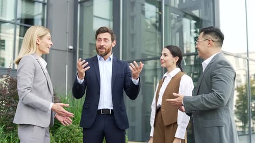 Business Team Applauding Outside Office Building