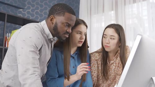 Multiethnic professional office workers working together at workplace.