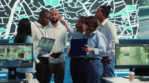 Diverse Team Examines Data in Modern Office