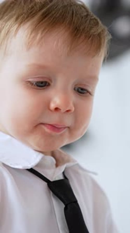 Cute Young Boy with Blond Hair and Blue Eyes