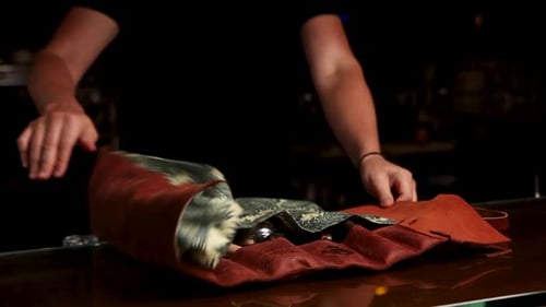 the bartender prepares a cocktail at the bar