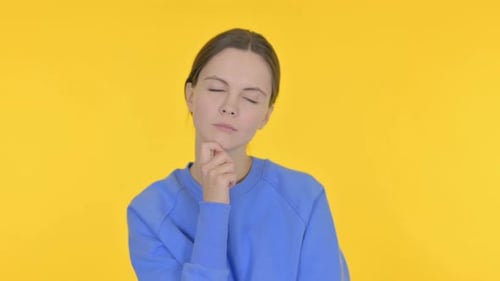 Brainstorming Young Woman Thinking Idea on Yellow Background