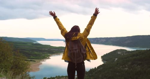 4k video footage of a female celebrating on a mountain top