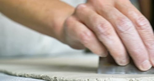 close up of old craftsman handmade clay and mold to create home-made jars and artwork. Concept of: