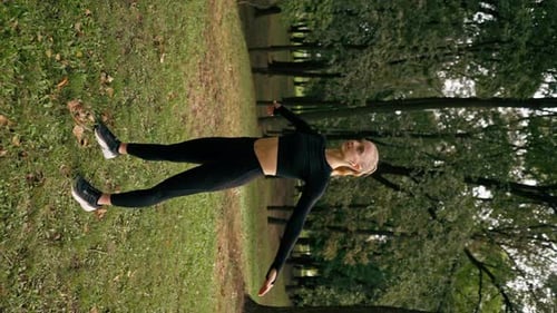 Active Woman Stretching in an Urban Park