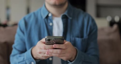 Adult Uses Mobile Phone in a Close Up Shot