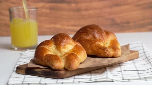 Golden Croissants Served with Juice for Breakfast