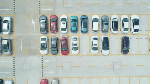 Aerial Top Down View a Parking Lot with Cars of Different Colors Camera Moves Right