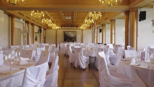 Elegant banquet hall prepared for wedding celebration – wide interior shot