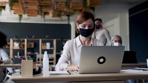 Business team portraits wearing face masks working together in modern office