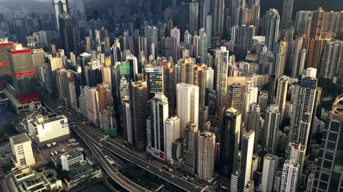 Drone, city and buildings, skyscraper and infrastructure outdoor in urban development at cbd in Hong