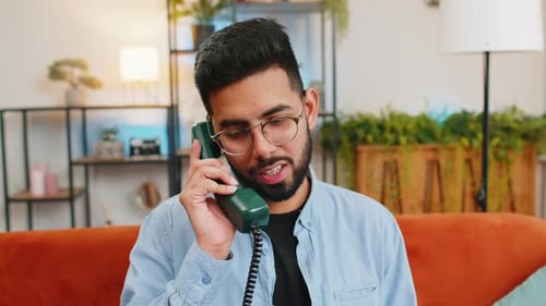 Man Talks on a Vintage Rotary Telephone