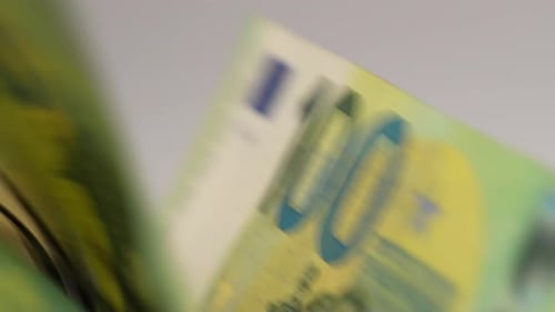 Euro Banknotes Run Through Counting Machine Close Up