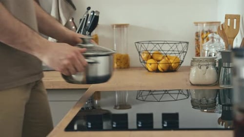 Cooking Pot Placed on Glass Stove in Kitchen