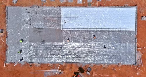 Workers on Building Foundation Aerial View