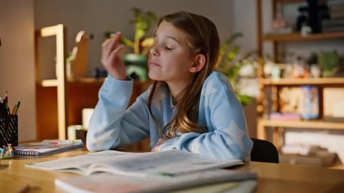 Bored School Girl Studying Alone Looking Notebooks Wooden Table Closeup
