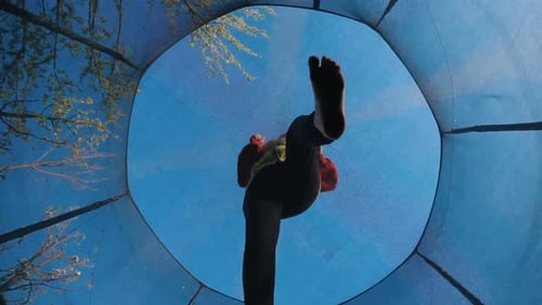 Child Having Fun Jumping on a Trampoline