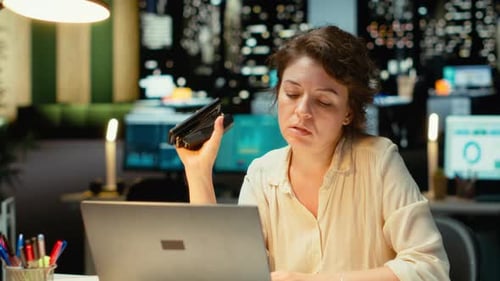 Woman Working Late in Office With Desk Toys