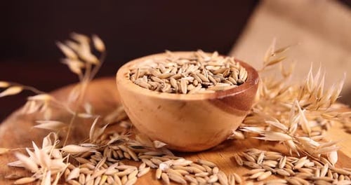 Close Up of Grain Oats in Wooden Bowl