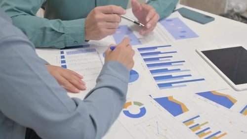Close Up of People Working on Documents