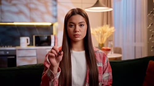 Young Woman Shakes Finger, Making No Sign