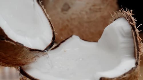 Water Poured into Cracked Coconut Shell