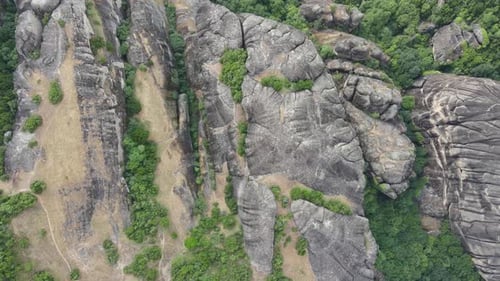 Top view of spectacular landscape formed of deposits of stone, sand, and mud from streams flowing in