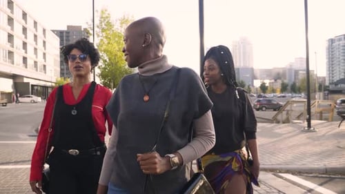 Smiling Women Friends Walking and Talking in Sunny City 10 Seconds or Greater