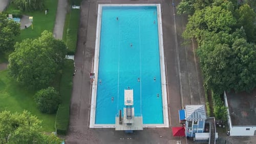 Aerial view of public pools surrounded by greenery, Germany.