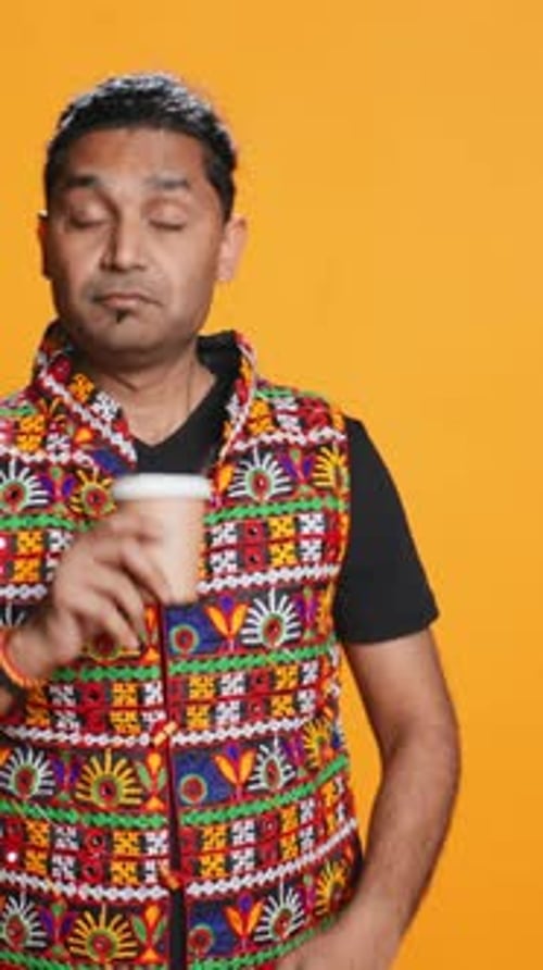 Vertical Video Exhausted Person Yawning Drinking Coffee Isolated Over Studio Background