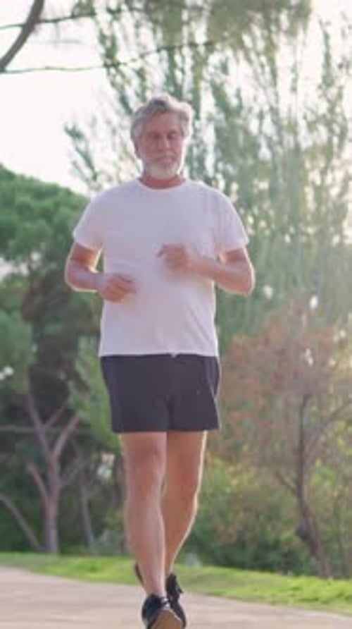 Healthy Senior Man Jogging in the Park