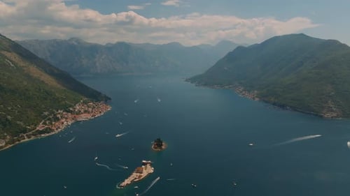 Aerial drone view of two islands Our Lady of the Rocks and Island of Saint George with churches and