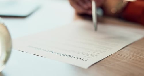 Hands, writing and prenuptial agreement for marriage with legal protection for assets