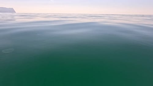 Sea Water Surface Low Angle View Over Clear Azure Sea Water Sun Glare Abstract Nautical Summer Ocean