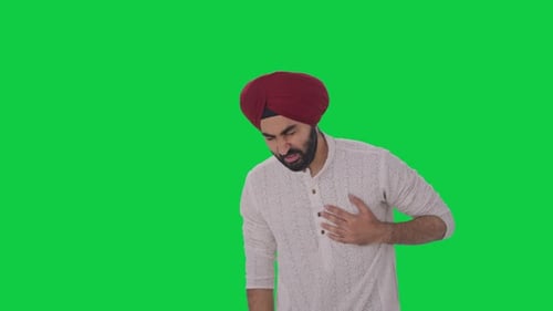 Sick Sikh Indian man having an heart attack Green screen