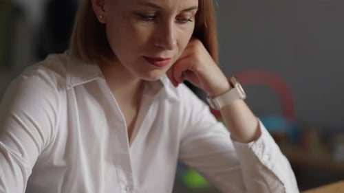 Business Woman Playing Chess At Home