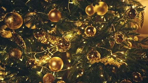 Christmas Tree with Gold Ornaments and Lights