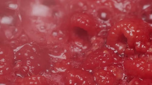 Raspberries Boiling in a Crimson Mixture
