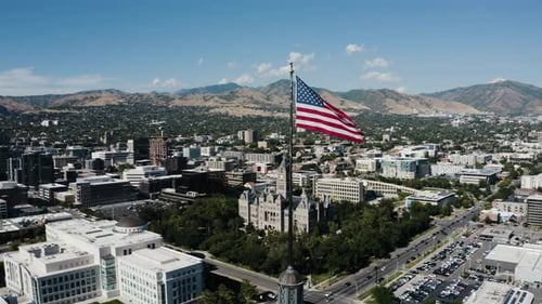 Aerial View of Cityscape with American Flag