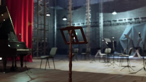 Elegant Old Opera Stage Featuring a Music Stand Piano and Seating Area