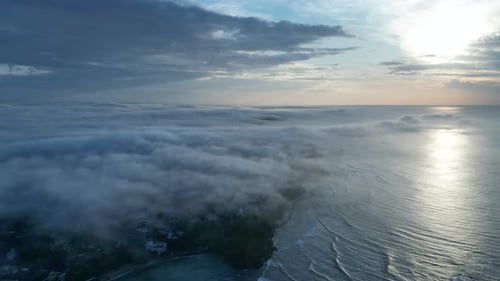 Aerial Hyperlapse Footage Glides Over Ocean Captures Tranquil Sunrise at Beach Coastline Meets
