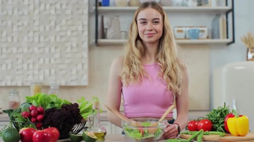 Woman with Salad Ingredients in Bright Kitchen