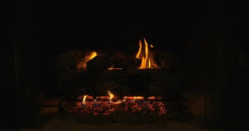 A toasty fireplace crackling on a cold winter night.