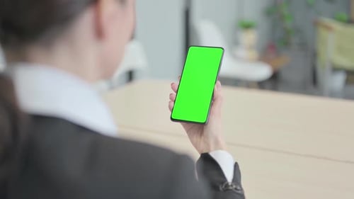 Businesswoman Using Phone with Green Chroma Screen