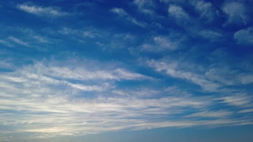 Blue Sky with Slow Moving Clouds