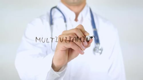 Multivitamins Doctor Writing on Glass