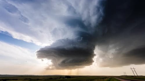 Impressive Storm Clouds over Rural Landscape at Sunset