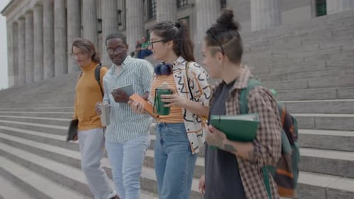 Young Students Leaving University and Having Discussion